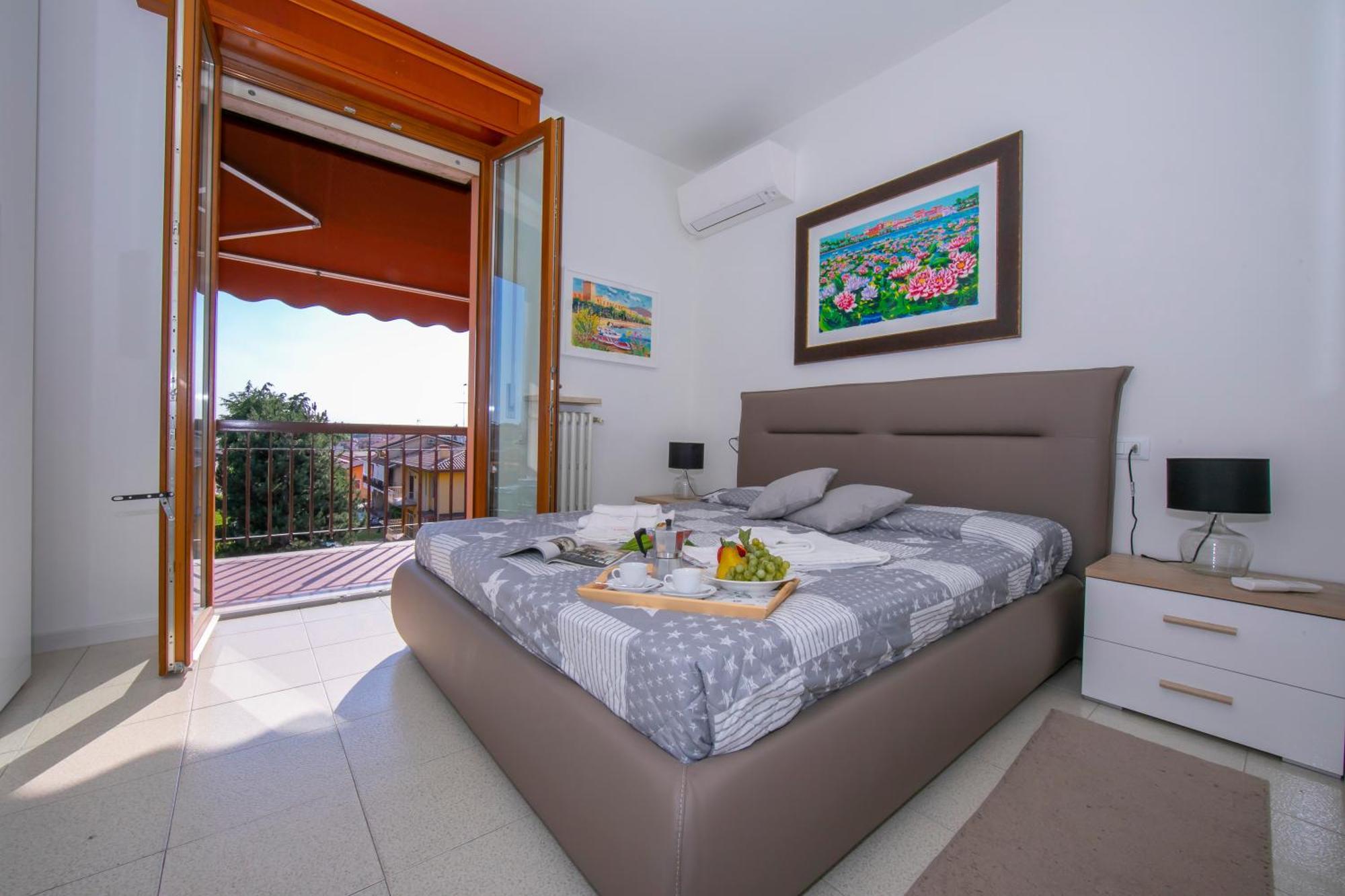 Casa Dei Quadri - Happy Rentals 佩斯基耶拉德加达 外观 照片